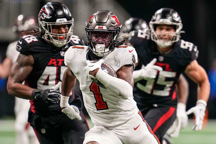 Tampa Bay Buccaneers running back Rachaad White (1) runs for a touchdown against the Atlanta Falcons during the second half at Mercedes-Benz Stadium.